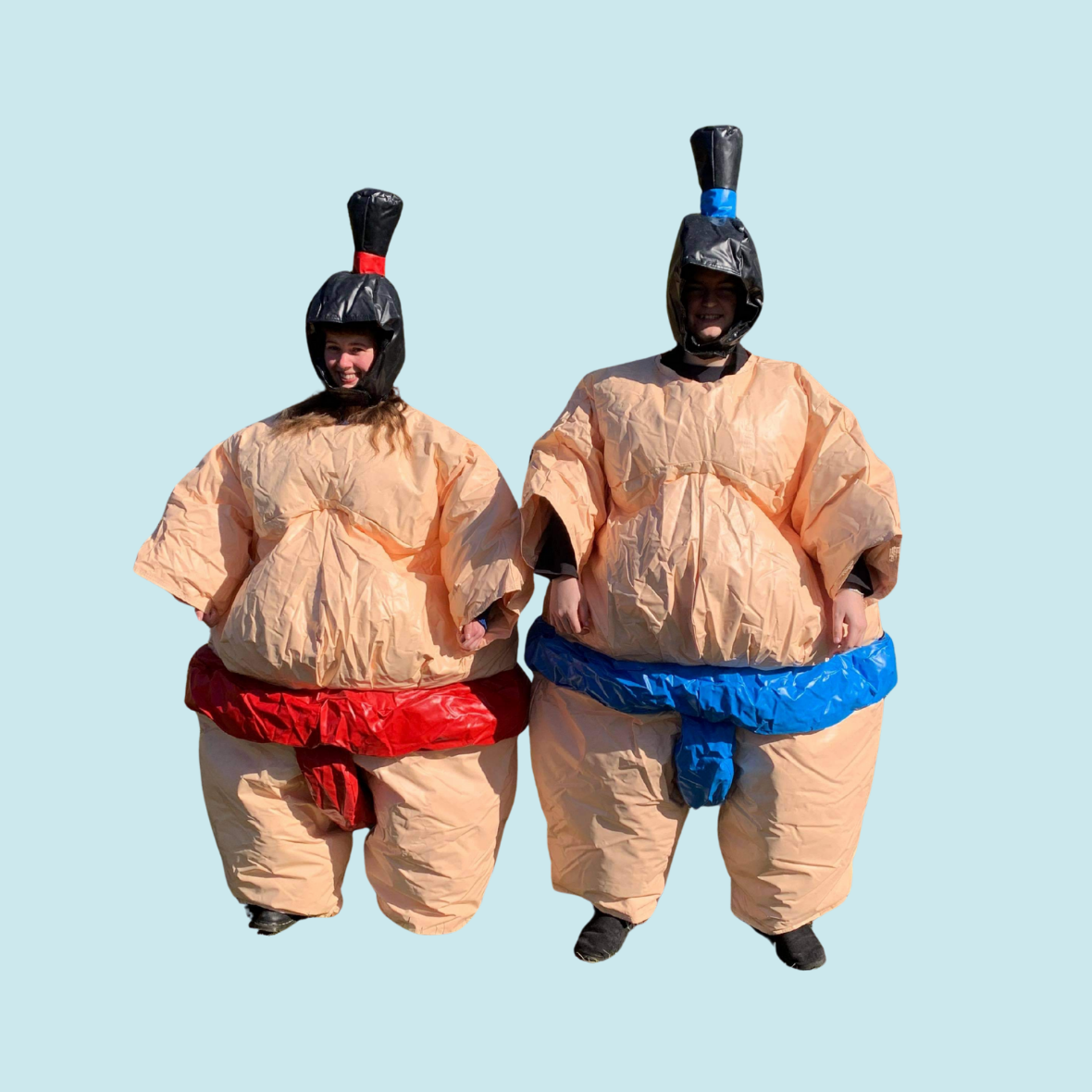 Eight shirts arranged on table in black, olive, grey, blue, white, red, mustard, and green.