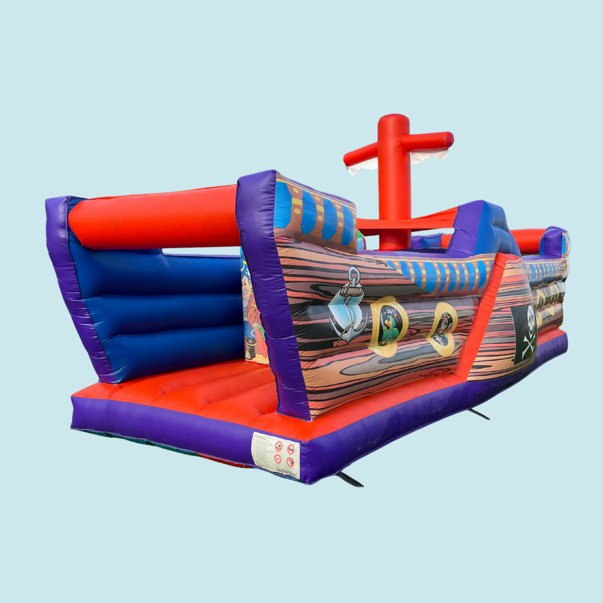 Eight shirts arranged on table in black, olive, grey, blue, white, red, mustard, and green.