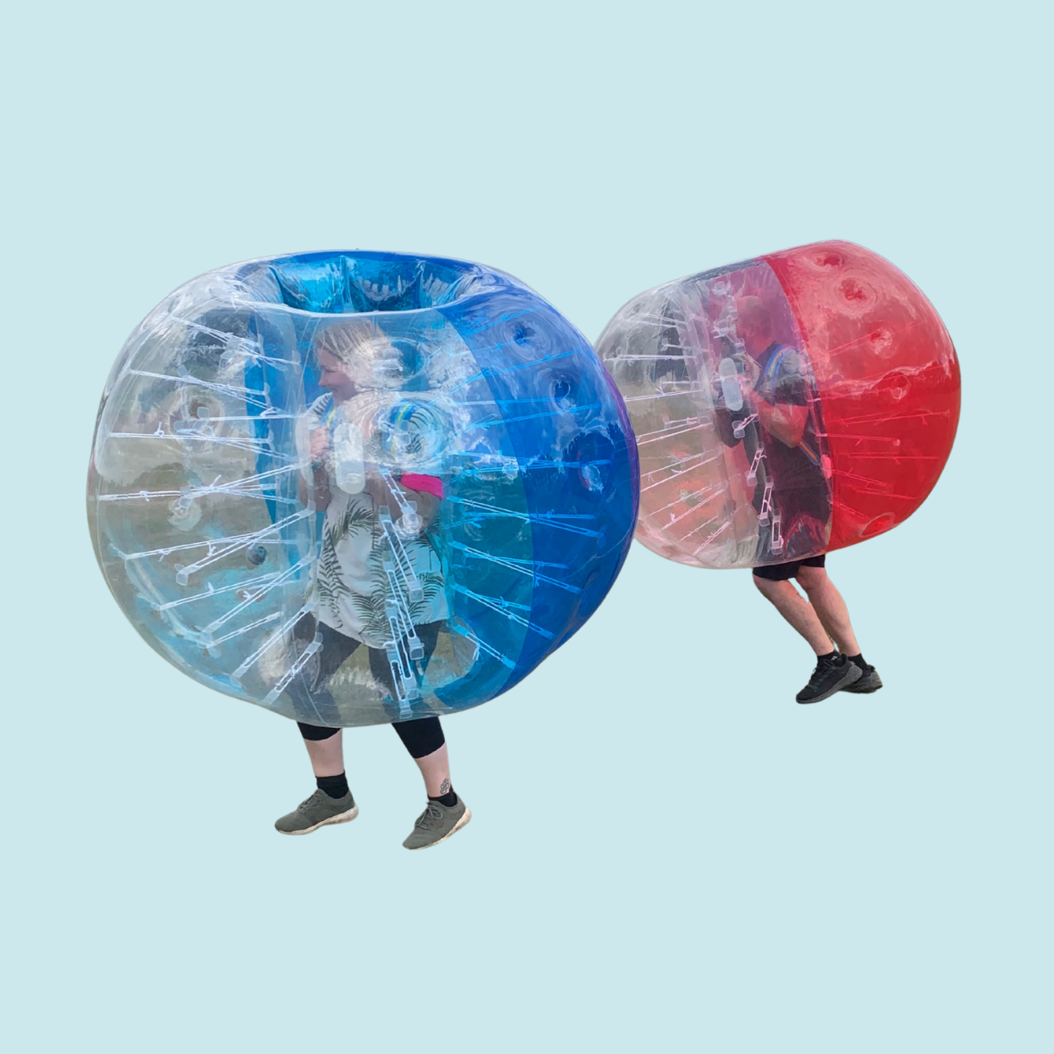 Eight shirts arranged on table in black, olive, grey, blue, white, red, mustard, and green.